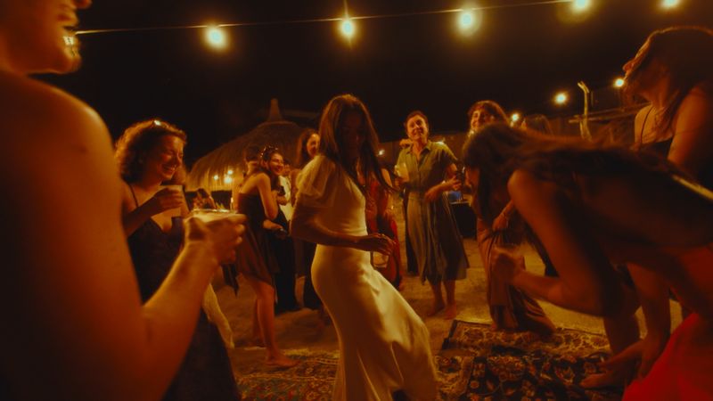 Dancing barefoot on the sand at night
